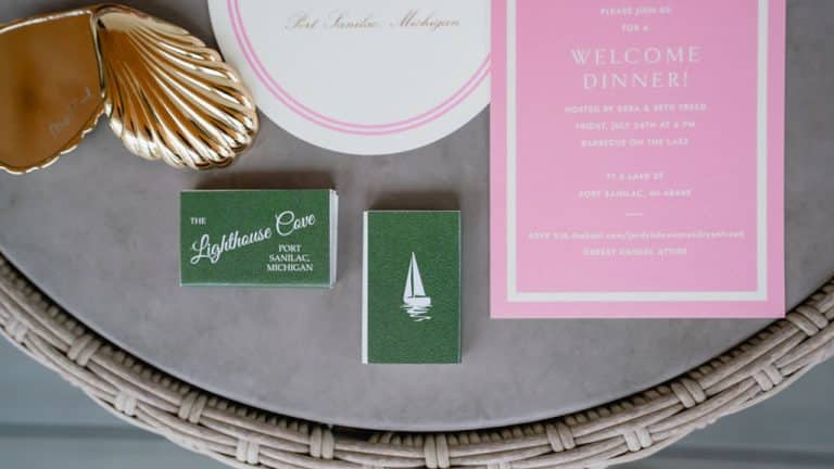 Wedding stationery with Lighthouse Cove matchbooks and a shell